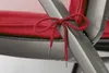 Close-up of a red tie on a gray chair frame. Produktbild-Vorschau