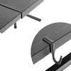 A close-up view of a black metal shelf with a hook attached to the underside. Náhľad obrázku produktu