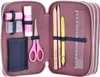 An open pencil case filled with stationery items. Náhled obrázku produktu
