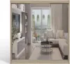 A modern living room with a sectional sofa, coffee table, and a large window overlooking a scenic view. Produktbild-Vorschau