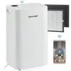A white air purifier is shown with two replacement filters and a smartphone displaying its app interface. Produktbild-Vorschau