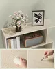 A collage of images showing a light wood bookshelf with decorative items and close-ups of its material. Náhled obrázku produktu