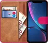 A book-style phone case for an iPhone XR, open to reveal card slots and cash. Produktbild-Vorschau