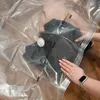 A person is shown using a vacuum seal bag to store clothing. Náhľad obrázku produktu