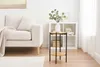 A living room scene with a sofa, a side table, and a bookshelf. Podgląd zdjęcia produktu