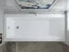 A top-down view of a white rectangular bathtub in a modern bathroom setting. Produktbild-Vorschau