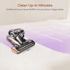 A vacuum cleaner is shown on a white surface, with purple lines indicating movement or cleaning paths. Náhľad obrázku produktu
