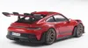 A red Porsche 911 GT3 RS model car is shown from a rear-quarter angle against a white background. Produktbild-Vorschau