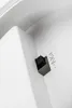 A close-up view of a white plastic surface with a black switch and some text. Produktbild-Vorschau