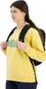 A young woman wearing a yellow sweatshirt and a black backpack. Anteprima dell’immagine prodotto