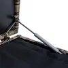 A close-up view of a gas strut mechanism attached to a polyrattan storage box. Produktbild-Vorschau