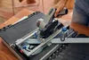 A person is using a DREMEL Blueprint Mobile Saw Station to cut a piece of material. Produktbild-Vorschau
