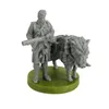 A miniature figurine of a soldier standing next to a boar, both on a green base. Anteprima dell’immagine prodotto