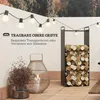 An outdoor patio scene with a firewood rack, string lights, and a lantern. Produktbild-Vorschau