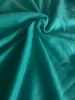 A close-up shot of a crumpled turquoise fabric. Produktbild-Vorschau