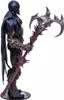 A side view of a detailed action figure of Raven Spawn, holding a large, ornate weapon. Podgląd zdjęcia produktu