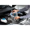 A person is pouring motor oil into a car engine. Produktbild-Vorschau