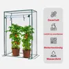 A transparent greenhouse with two tomato plants inside, next to a panel with feature descriptions and icons. Náhled obrázku produktu