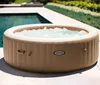 An inflatable hot tub filled with water is situated on a patio next to a swimming pool. Náhľad obrázku produktu