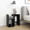 A black bedside table with books and decorative items next to a bed. Podgląd zdjęcia produktu
