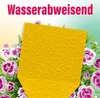 A yellow sticky trap covered in water droplets, surrounded by pink and purple flowers and green leaves. Produktbild-Vorschau