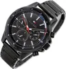 A close-up, angled shot of a black Tommy Hilfiger chronograph watch with a metal band, set against a white background. Produktbild-Vorschau