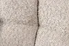A close-up view of a textured fabric, likely bouclé, with a seam running vertically down the center. Produktbild-Vorschau