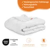 A folded white blanket is shown on a white background, with marketing text and logos around it. Anteprima dell’immagine prodotto