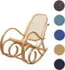 A wooden rocking chair with a rattan seat is shown against a white background, with swatches of different fabric colors displayed to the right. Voir les images du produit