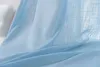 A close-up view of light blue fabric with a linen-like texture, draped and folded. Produktbild-Vorschau