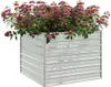 A square planter filled with vibrant red and purple flowers. Produktbild-Vorschau