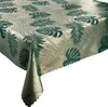 A tablecloth with a monstera leaf pattern is shown diagonally on a white background. Produktbild-Vorschau