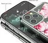 Close-up view of an iPhone case with a floral pattern, highlighting raised lips for screen and camera protection. Produktbild-Vorschau