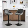 Two gray velvet bar stools in a modern kitchen setting. Produktbild-Vorschau