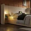 A bedroom scene with a bed, pillows, and blankets, featuring integrated lighting and charging. Anteprima dell’immagine prodotto