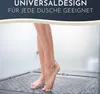 A person's legs are shown standing on a grey shower mat in a shower. Voir les images du produit