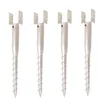 Four metal screw-in post anchors are arranged in a row against a white background. Náhled obrázku produktu