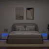 A bedroom scene with a bed and two nightstands. Produktbild-Vorschau