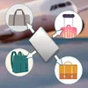 A product image showing a silver cardholder in the center, with arrows pointing to different types of bags (duffel, backpack, suitcase, briefcase) in circles around it, and an airplane in the background. Podgląd zdjęcia produktu