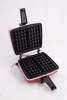 An open waffle maker on a white background. Anteprima dell’immagine prodotto