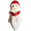 A cute ghost figurine wearing a Santa hat and reading a book. Produktbild-Vorschau