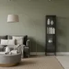 A living room scene with a sofa, coffee table, floor lamp, and a display cabinet. Produktbild-Vorschau
