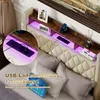 A bed with a headboard featuring shelves, LED lighting, and integrated USB ports and power outlets. Náhled obrázku produktu