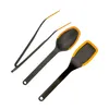 A set of three kitchen utensils, including tongs, a spoon, and a spatula, arranged diagonally on a white background. Produktbild-Vorschau