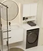 A modern bathroom with a sink, washing machine, and storage unit. Produktbild-Vorschau