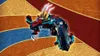 A LEGO dragon model is shown against a colorful, abstract background. Náhled obrázku produktu