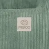 A close-up of a green corduroy fabric with a beige label. Podgląd zdjęcia produktu