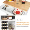A collage of images showing different storage compartments of a kitchen cart, including drawers with dishes and cutlery, a wine rack, and shelves with jars. Produktbild-Vorschau