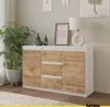 A sideboard with drawers and doors is shown in a room setting with a plant and a lamp. Produktbild-Vorschau