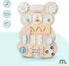 A Montessori busy board shaped like a bear, featuring various interactive elements for children. Produktbild-Vorschau